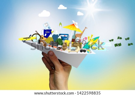 Paper airplane with rest attributes on summer background. The concept of a summer vacation. image