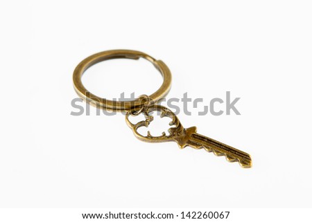 A golden key on white background