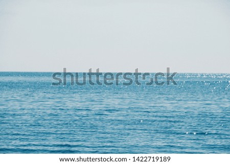 Sea in clear weather. Sea on a sunny day. Summer . . Small waves. Sea and beach. Background sea and sky blue.