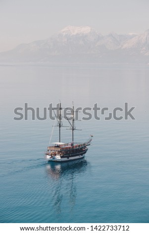 A picture of a ship approaching to the land.