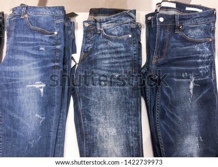 stacked of different Jeans background.
