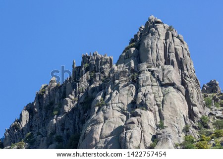 Scene with mountain of granite rocks, zone of nests of vultures, La Cabrera.