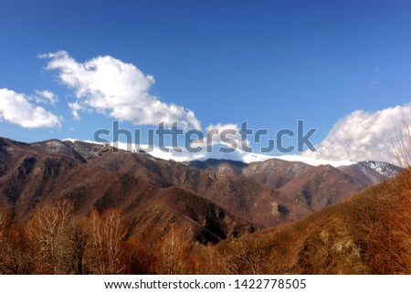 Mountain Range against blue sky, picture taken in Defileul Jiului Romania                 