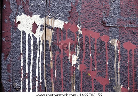 Close up view on colorful paint peeling off concrete walls found at a lost place in Kiel Germany