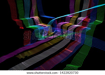 Colorful light painting. Long exposure photo, symbol of speed, energy, colors, science, technology