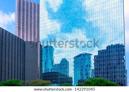 Houston downtown skyscrapers disctrict with mirror blue sky reflection