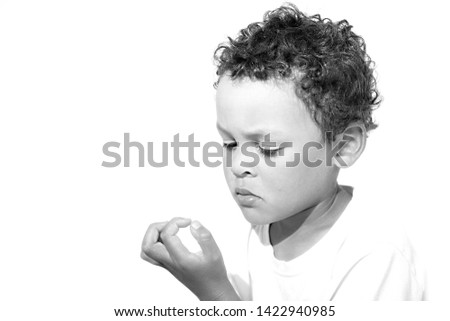 little boy picking his nose stock image on white background stock photo