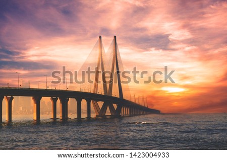 Bandra Worli sea link bridge of Mumbai and golden dramatic sky and cloud Royalty-Free Stock Photo #1423004933