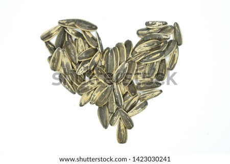sunflower seeds. Heart shaped sunflower seeds isolated on a white background