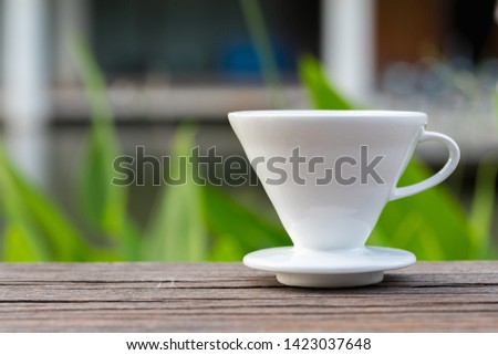 Drip cup on wooden outdoor