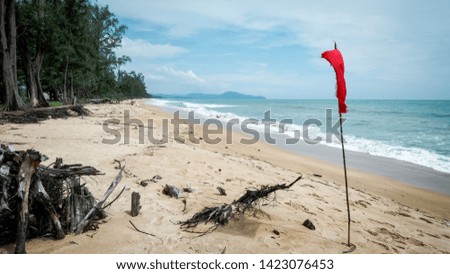 Big wave during raining season and Red flag for dangerous zone can not swimming in this area at sai kaew beach, phuket thailand