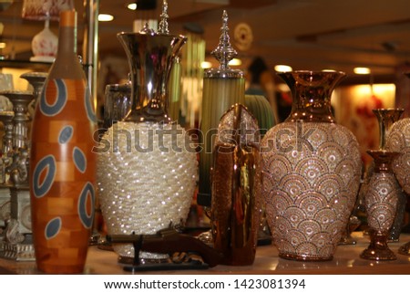 Brown and white hand made pots for decoration ,the antique pieces made of Thailand imported quality with blur background