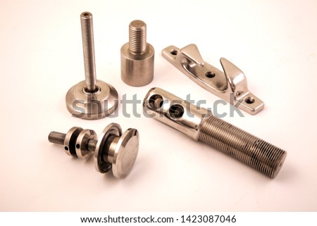 Buying now Industry Industry Group Composition Conceptual Photo Shoot Made of Stainless Stainless Chrome Objects on White Background. 