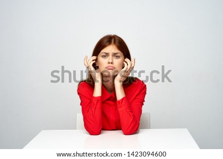 emotional woman in red shirt worker fatigue headache depression