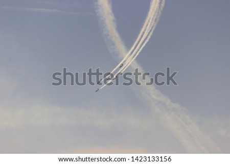 Airplanes performing an aerial acrobatics exhibition, Eagle patrol, San Javier Base, Murcia, Spain. Photo with space for advertising, blank space for your promotional text or advertising content, war