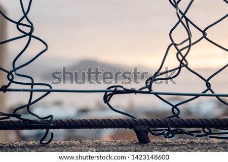 Whole made on a wire fence 