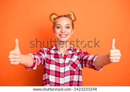 Portrait of lovely cute feminine lady have promotion promo ads feedback advise  tip pick excellent perfect isolated dressed checked shirt plaid fashionable orange background