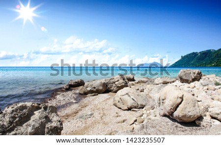 Summer background of beach and ocean with blue sky. Sunny hot day and free space for your decoration. 
