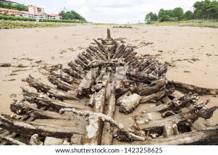 Very old shipwrecked boat on the coast of Zumaya, visible when the sea level descends.