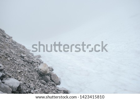 background of dirty white snow texture and stone