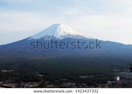 Close up top of beautiful Fuji mountain with snow cover on the top with could, Japan - Image
