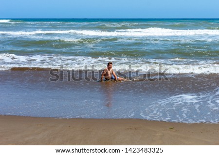 child playing on the sandy beach located in the delta of the Ebro called Trabucador