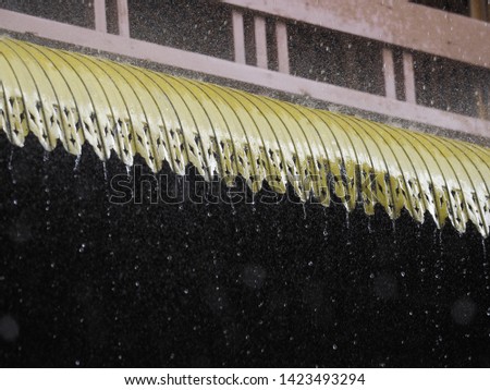 Heavy rain during the rainy season causing the water to flow down the roof.
