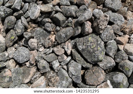 Texture with pile of granite rocks.