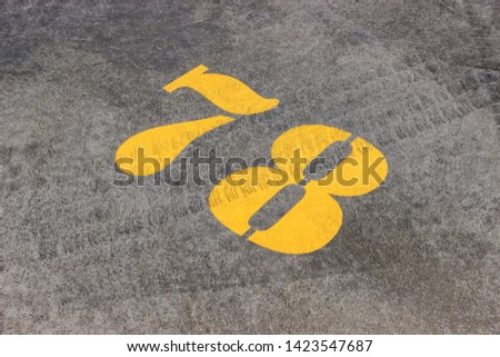 The number in the concrete parking lot for cars
