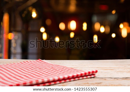 Table background with napkin and blurred bar background space
