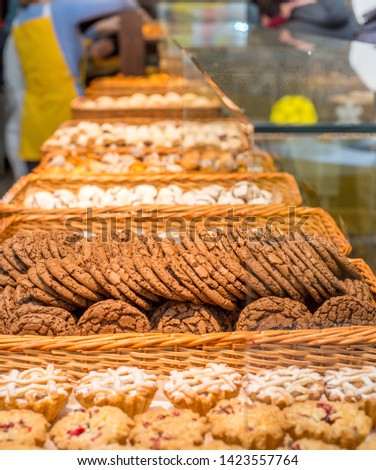 bakery products on display against the background of ovens in the bakery