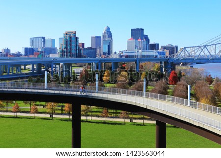 The Louisville, Kentucky skyline with pedestrian walkway in front Royalty-Free Stock Photo #1423563044