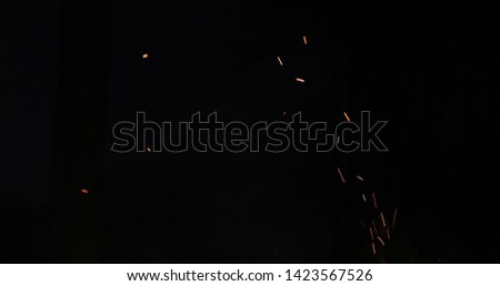 sparks of a fire on a black background