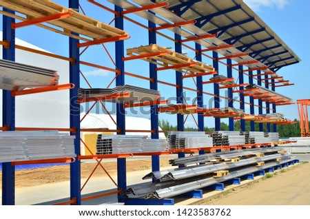 Warehouse Cantilever Racking Systems for storage Aluminum Pipe or profiles. Pallet Rack and Industrial Warehouse Racking. Steel profiles, sheet metal build-profile - Image Royalty-Free Stock Photo #1423583762