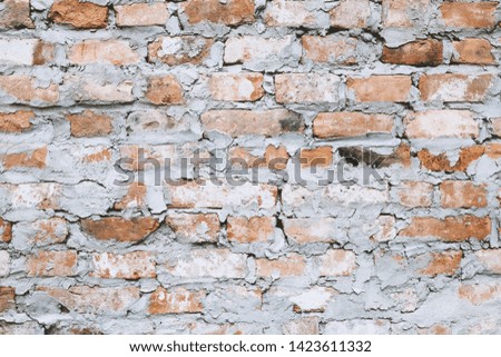 Old brick wall texture with scratches and crack. Ancient stone wall. 