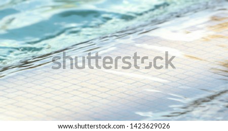 Swimming pool water texture surface in slow-motion