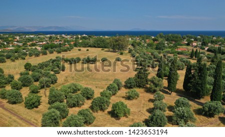 Aerial photo of archaeological site and monument of world famous Marathon tomb in the place of the historical battle between Athenians and Persians in city of Marathonas, Attica, Greece