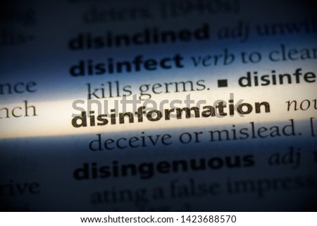 disinformation word in a dictionary. disinformation concept. Royalty-Free Stock Photo #1423688570