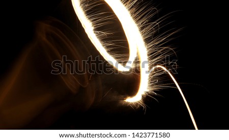 Playing hand firework at night 