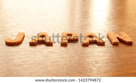 Cork Text Block of "Japan" on wooden table