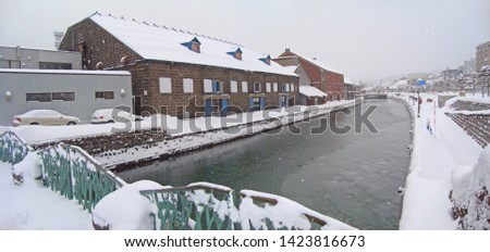 Otaru famous place landmark canal in snow and cityscape panorama in winter