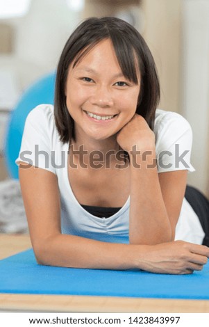 portrait of handsome happy woman practice yoga indoors