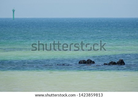 two tone color sea and lighthouse