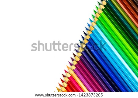 Close up of color pencils on white background with clipping path. Education frame concept.