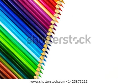 Close up of color pencils on white background with clipping path. Education frame concept.