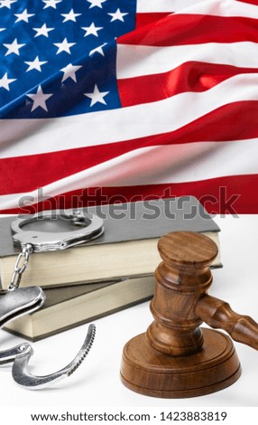 Wooden judge gavel on table, front close-up view