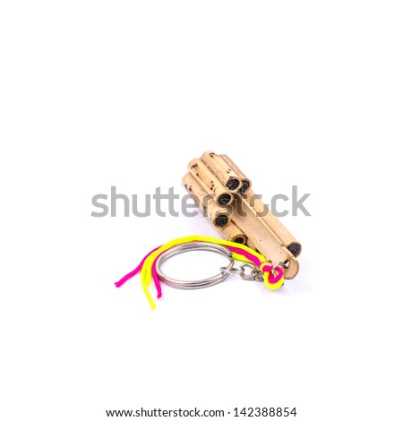 Bamboo Musical keychain from Thailand isolated on the white background.