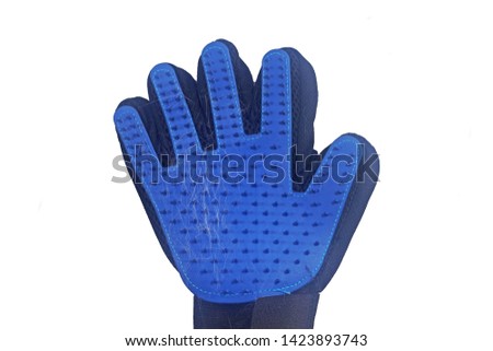 The rugged rubber gloves ,Gloves, brush the cat hair Isolated on white background.