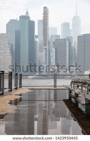 New York city skyline. Manhattan skyscrapers and Hudson river. Panoramic view, buildings reflections on rain water