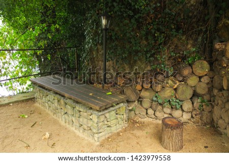  The lantern and the bench, wood and stone                               